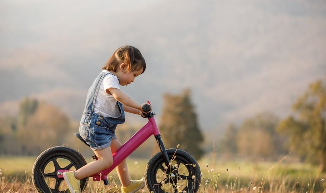 girl on balance bike