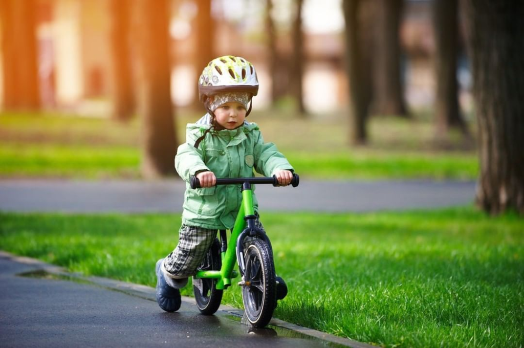 teaching kid to ride balance bike